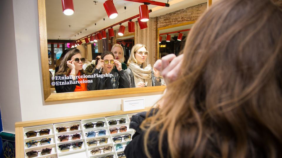 Women trying sunglasses at the shop Etnia Barcelona