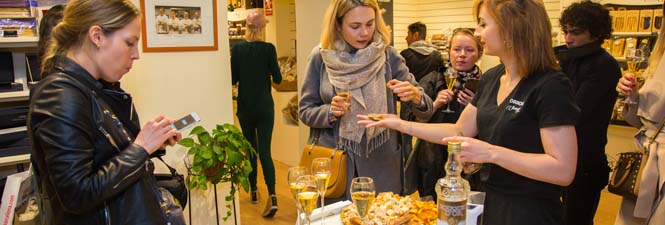 women tasting nougat and sweet wine