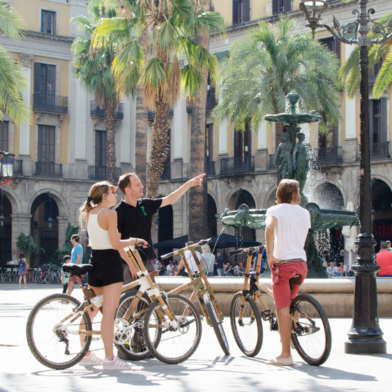 group cycling in the Pl. Reial in Barcelona